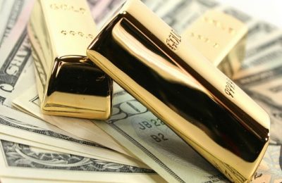 Three large gold bars on many dollar bills